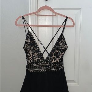 Sexy jumpsuit w/ detailed lace and crossover back